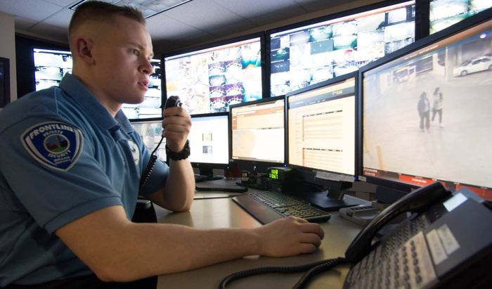Frontline operator monitoring cameras in the security operations center